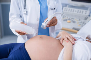 pregnant woman receiving ultrasound scan stomach scaled e1754317273977